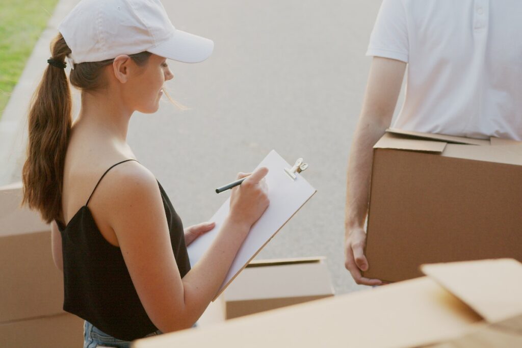 person packing and selecting a trustworthy moving company